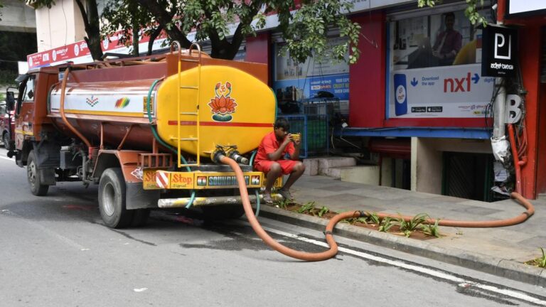 Water tanker delivering drinking water in Bangalore neighborhood